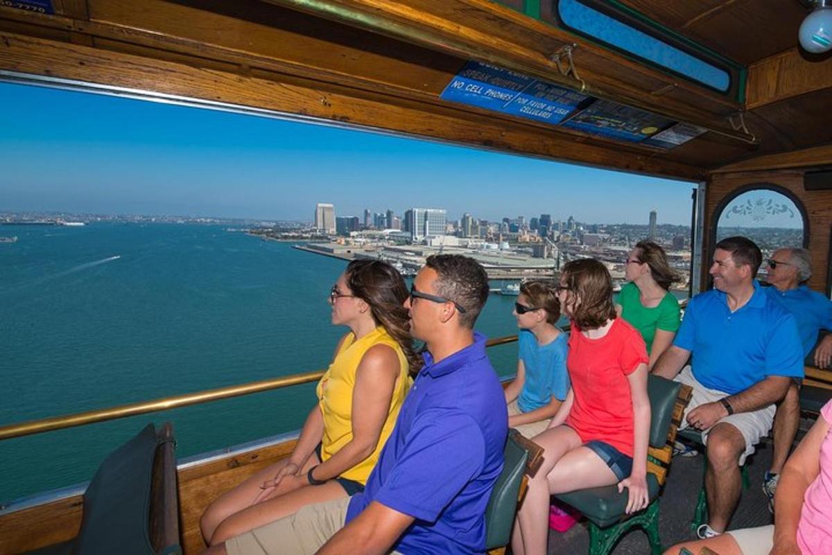 a group of people sitting on a boat on the water