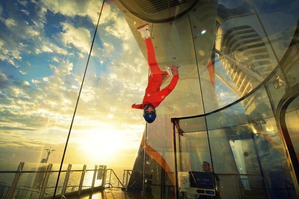 a person is on the bow of a cruise ship