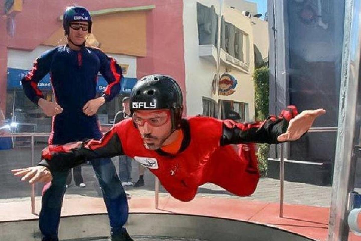 a man falling off of a ramp on a trampoline