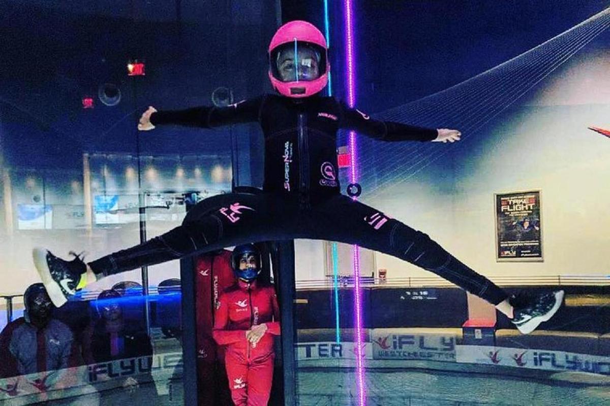 a person in a pink helmet and a person in