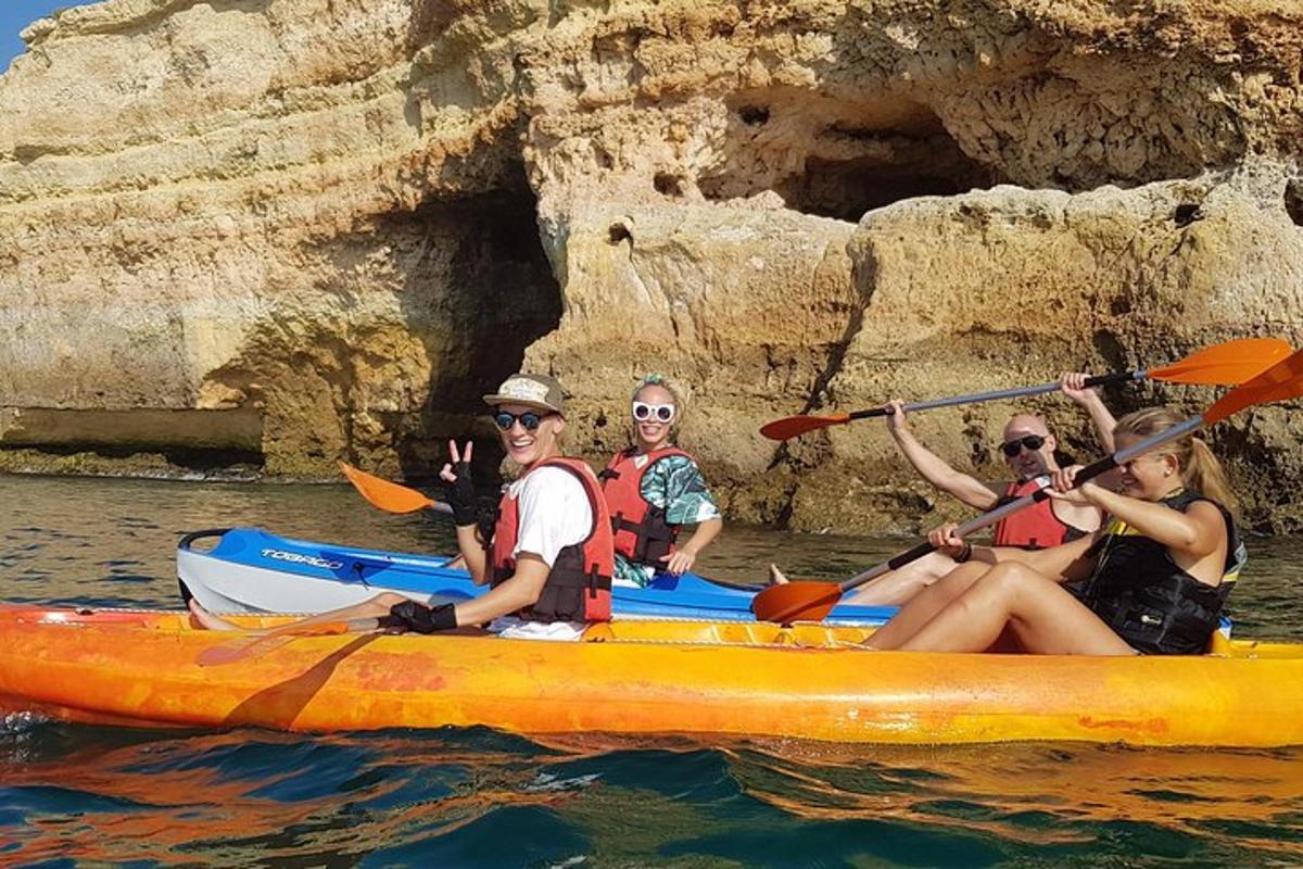 a group of people in a kayak in the water