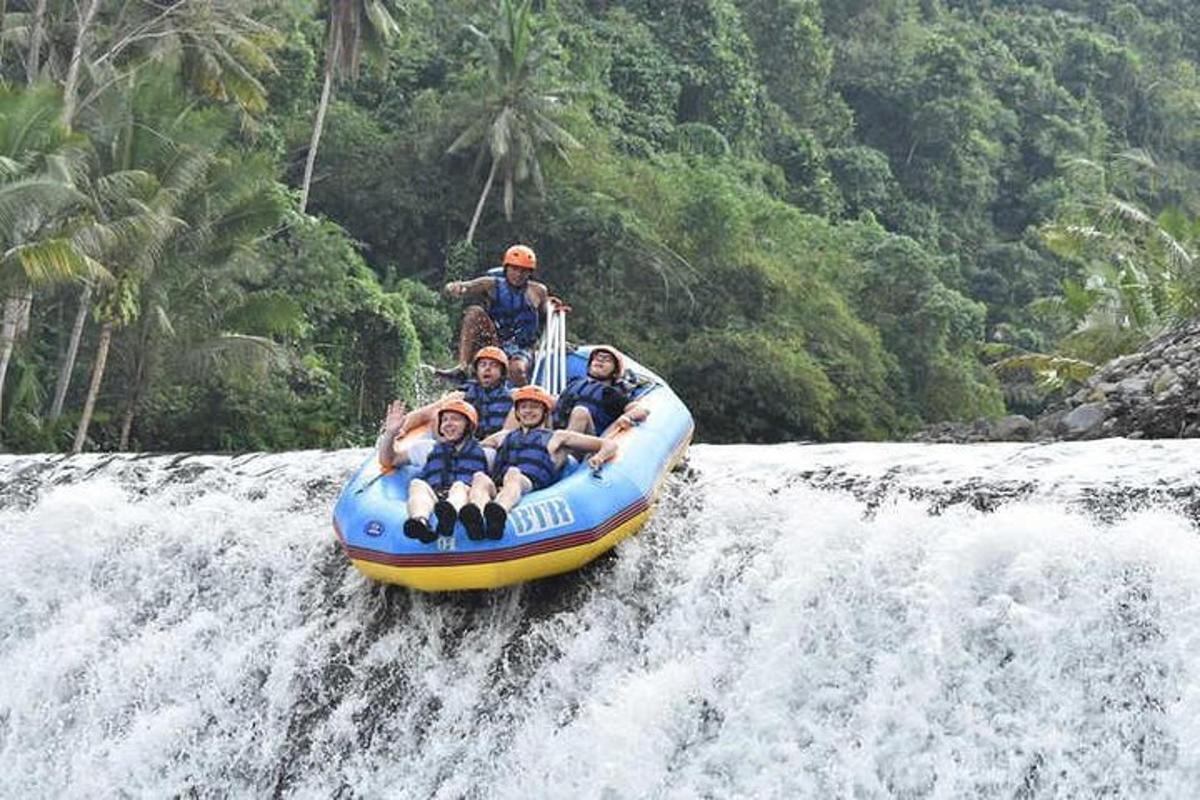 a group of people riding a raft on a river