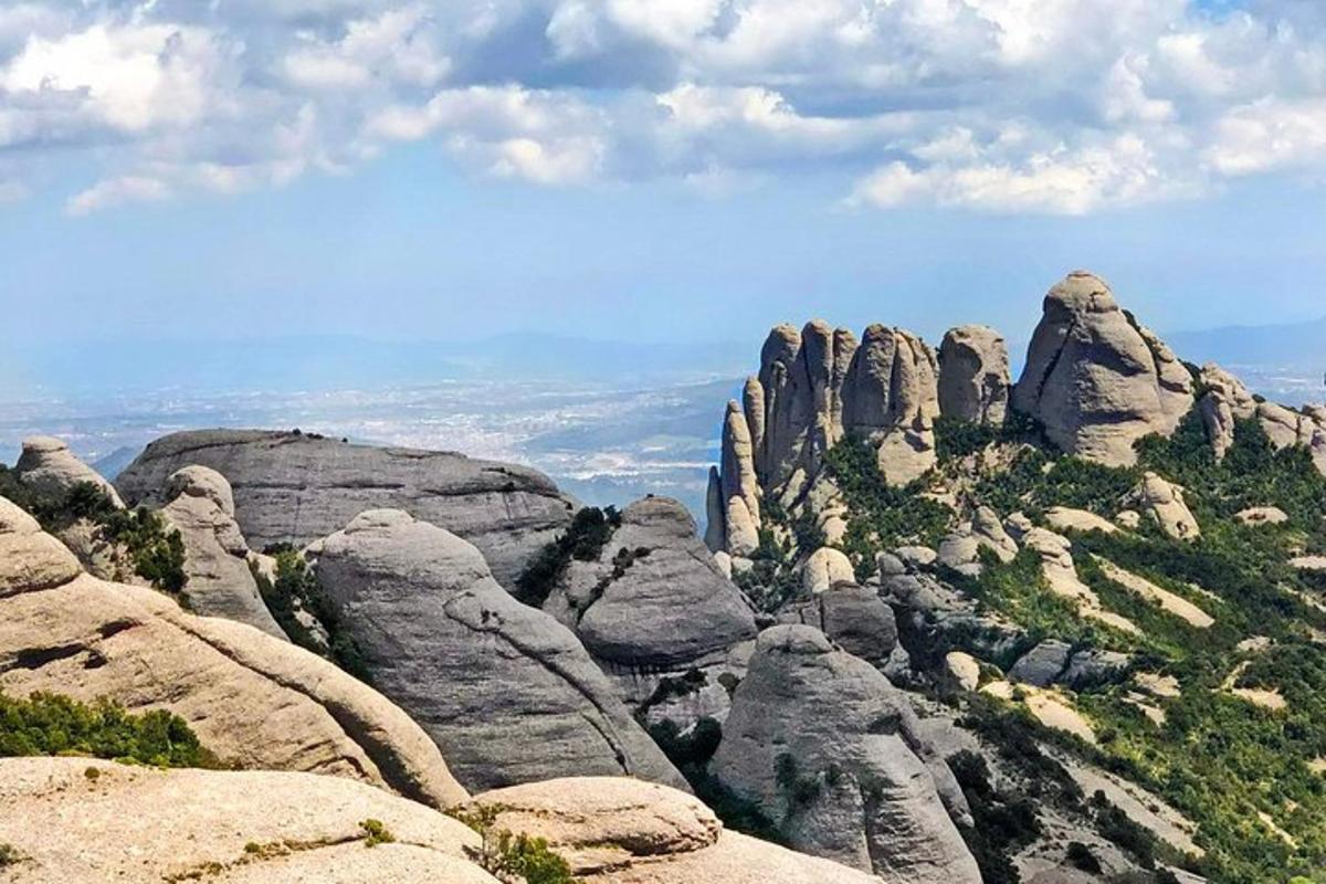 a view of a mountain with some rocks