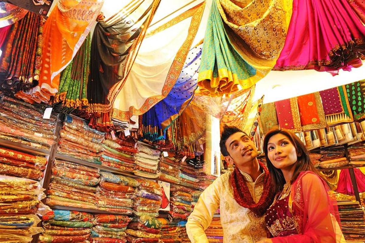 a man and a woman sitting in front of a store