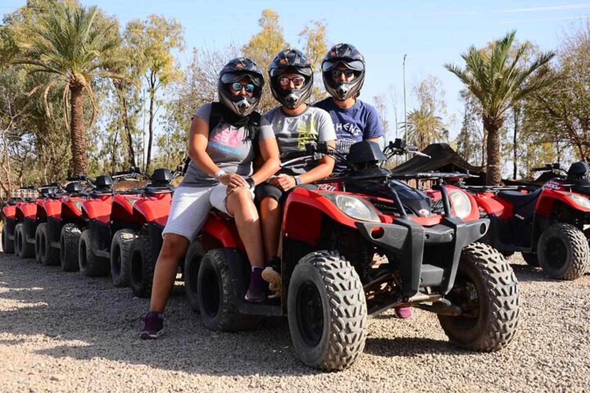 a group of people sitting on atvs