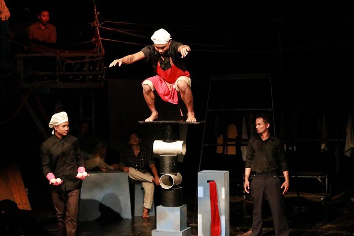 a man standing on top of a tower on a stage