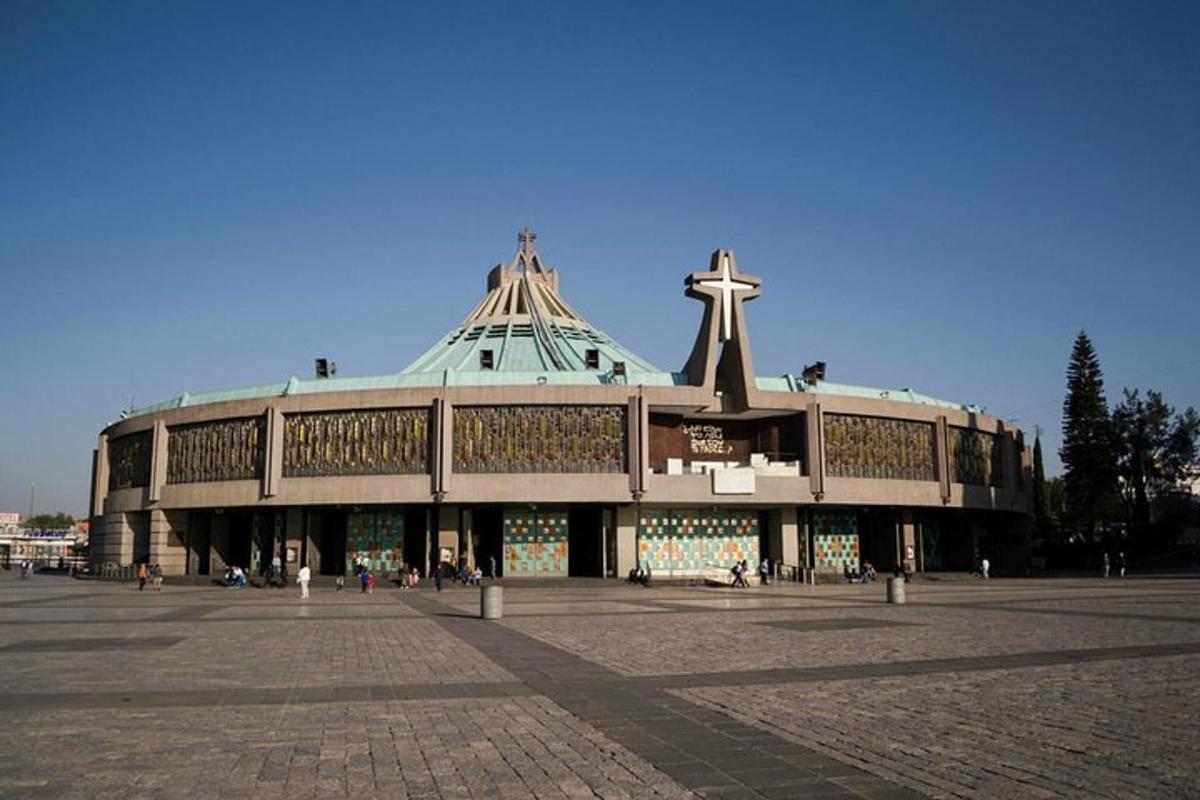 a large building with a cross on top of it