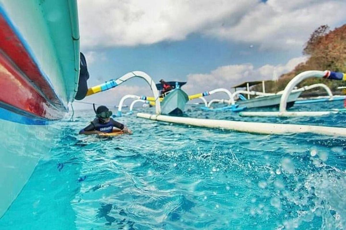 a person in the water on a water slide