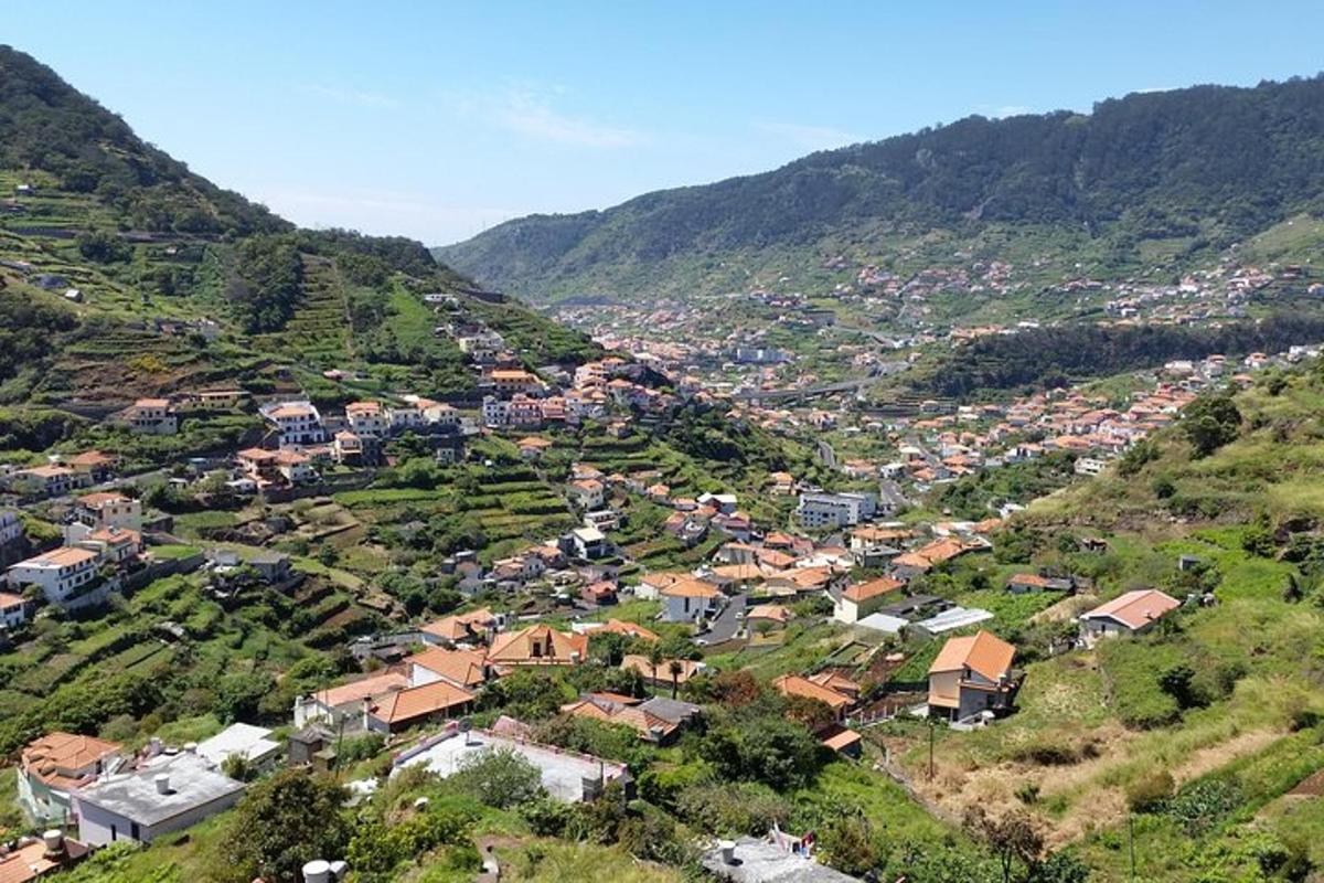 an aerial view of a town on a mountain