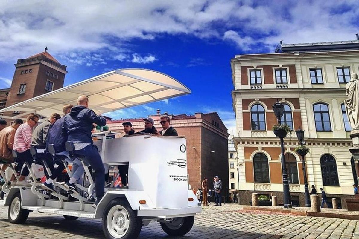 a group of people riding in a cart on a street