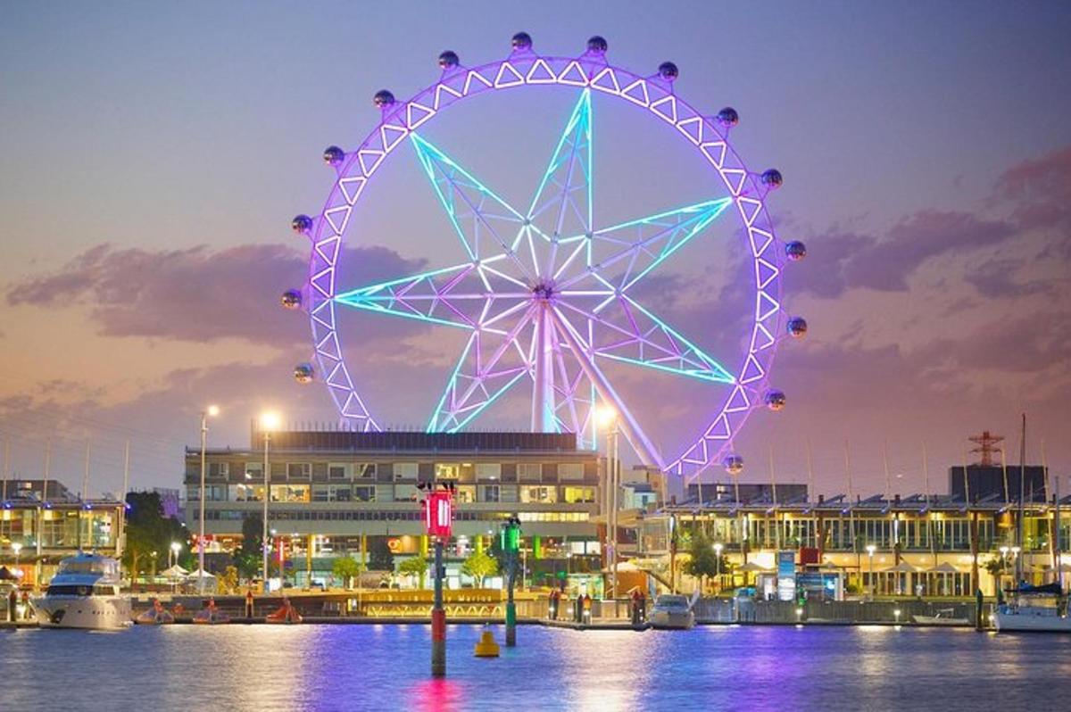 a ferris wheel is lit up at night