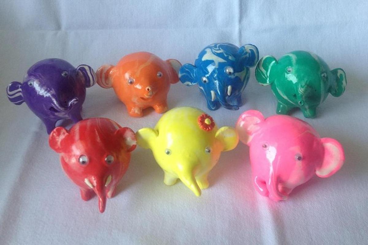 a group of plastic elephants sitting next to each other