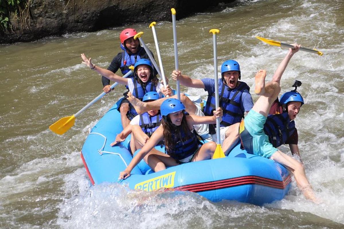 a group of people on a raft in the water