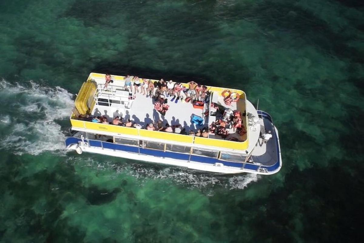a group of people on a boat in the water