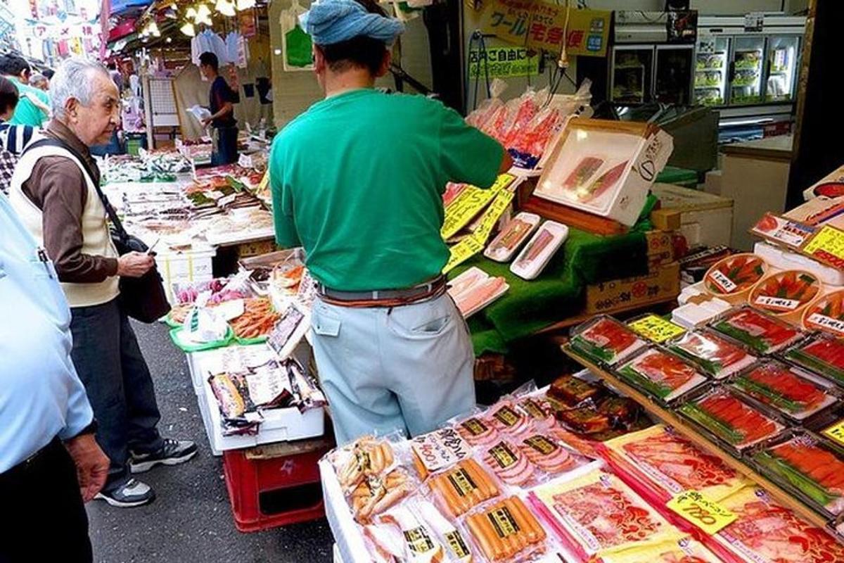 a man standing in a market selling food