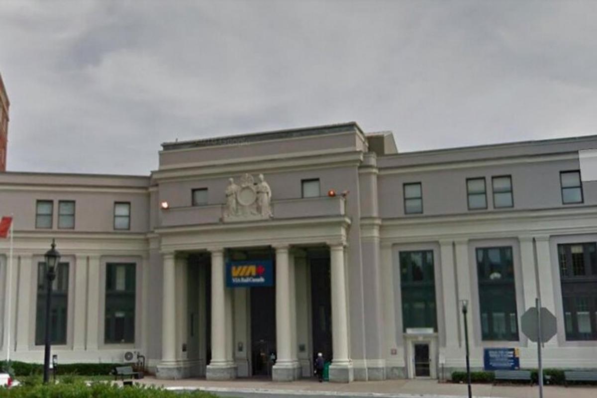 a large white building with a sign in front of it