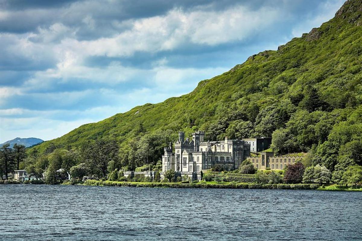 a large house on the shore of a body of water