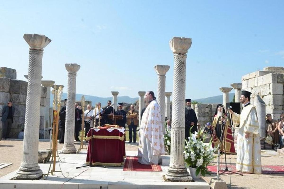 a group of priests standing in front of a table