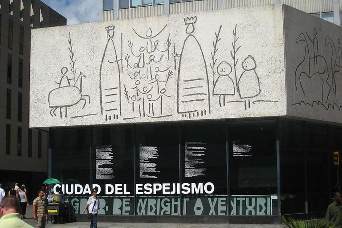 a painting on the side of a building with people on it