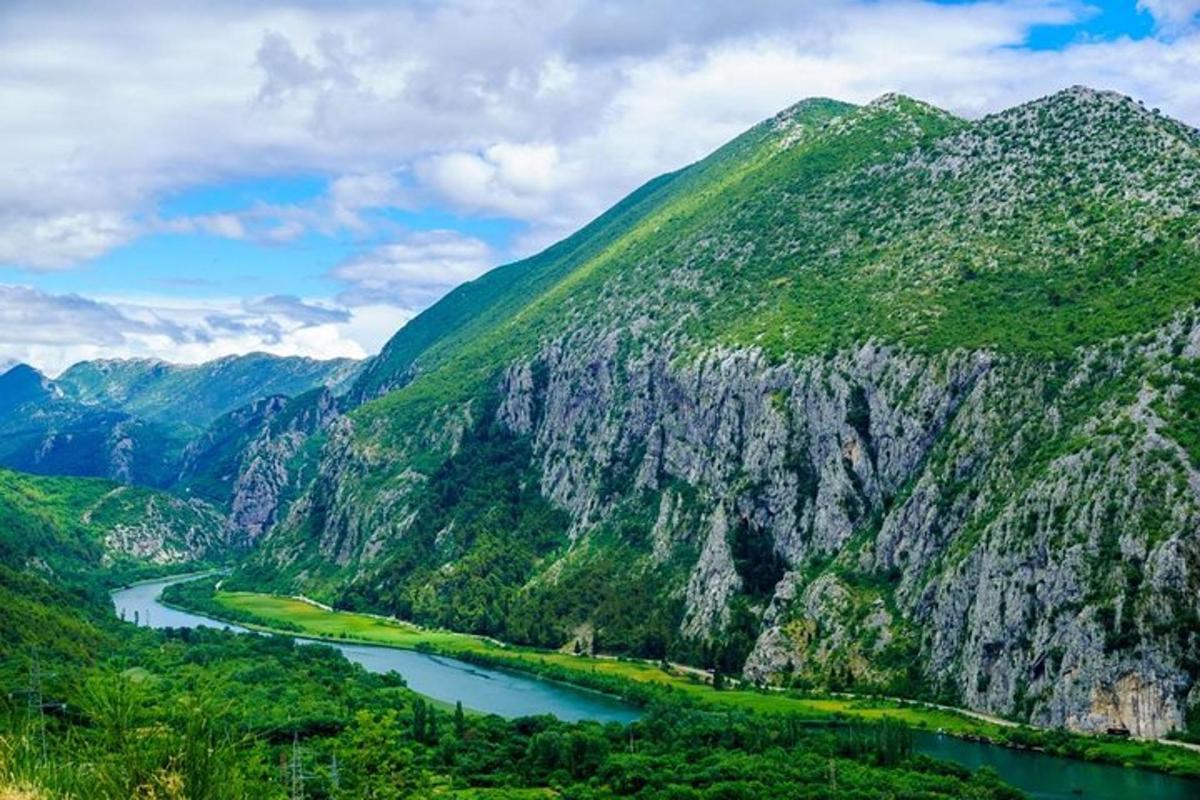 a mountain with a river in front of it