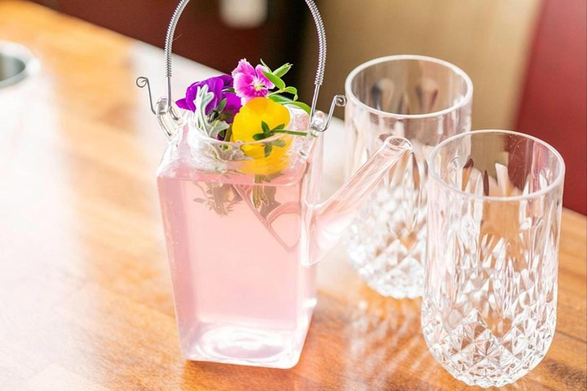 three glass vases with flowers in them on a table