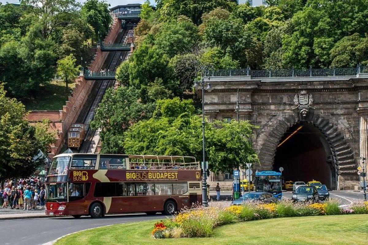 a double decker bus driving through a tunnel