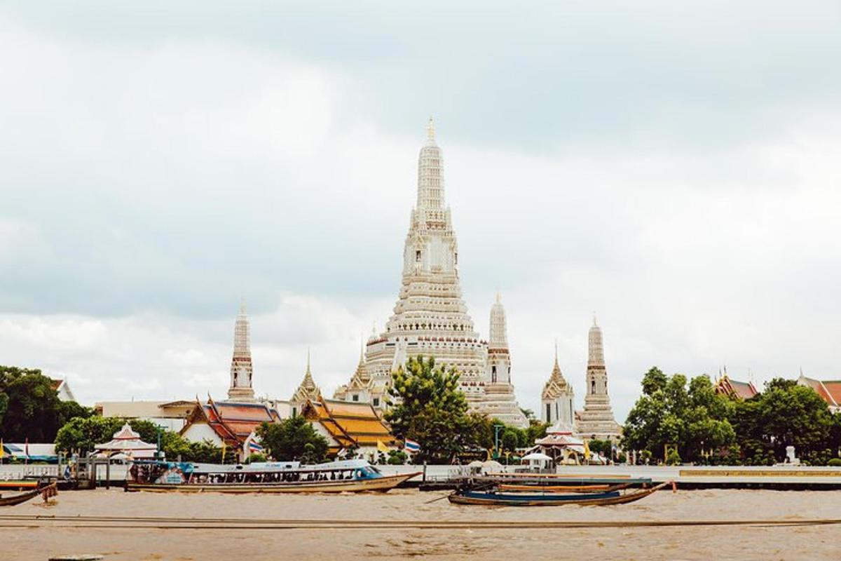 a view of a building with boats in front of it