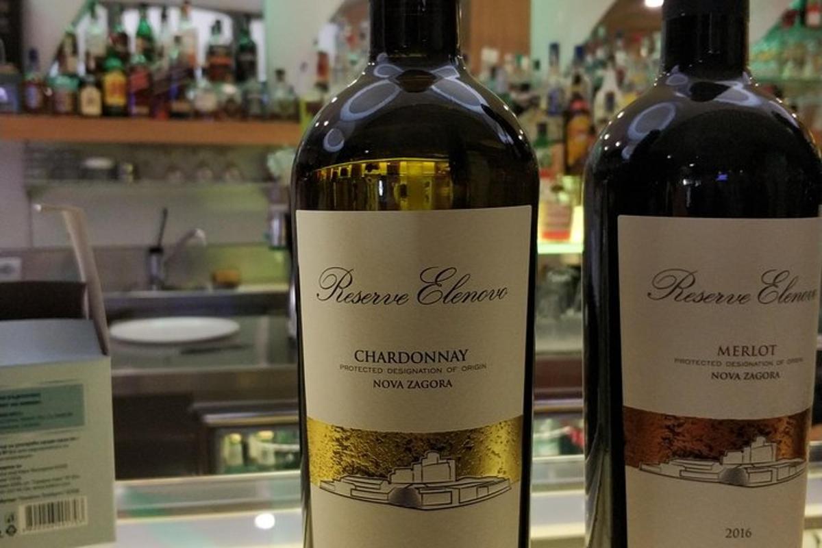 two bottles of wine sitting next to each other