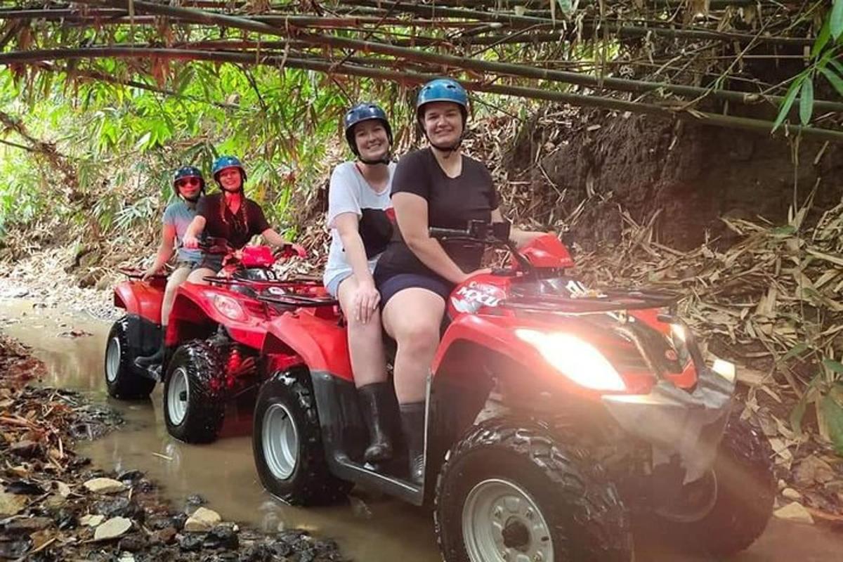 a group of people riding on atvs through the water