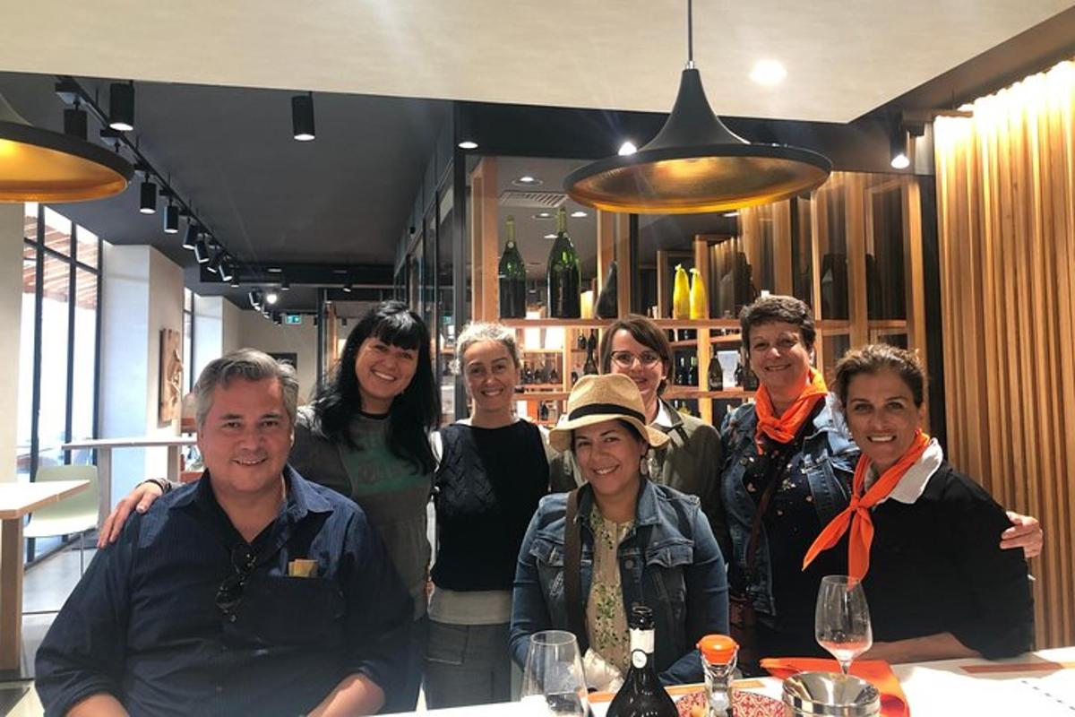 a group of people posing for a picture at a bar