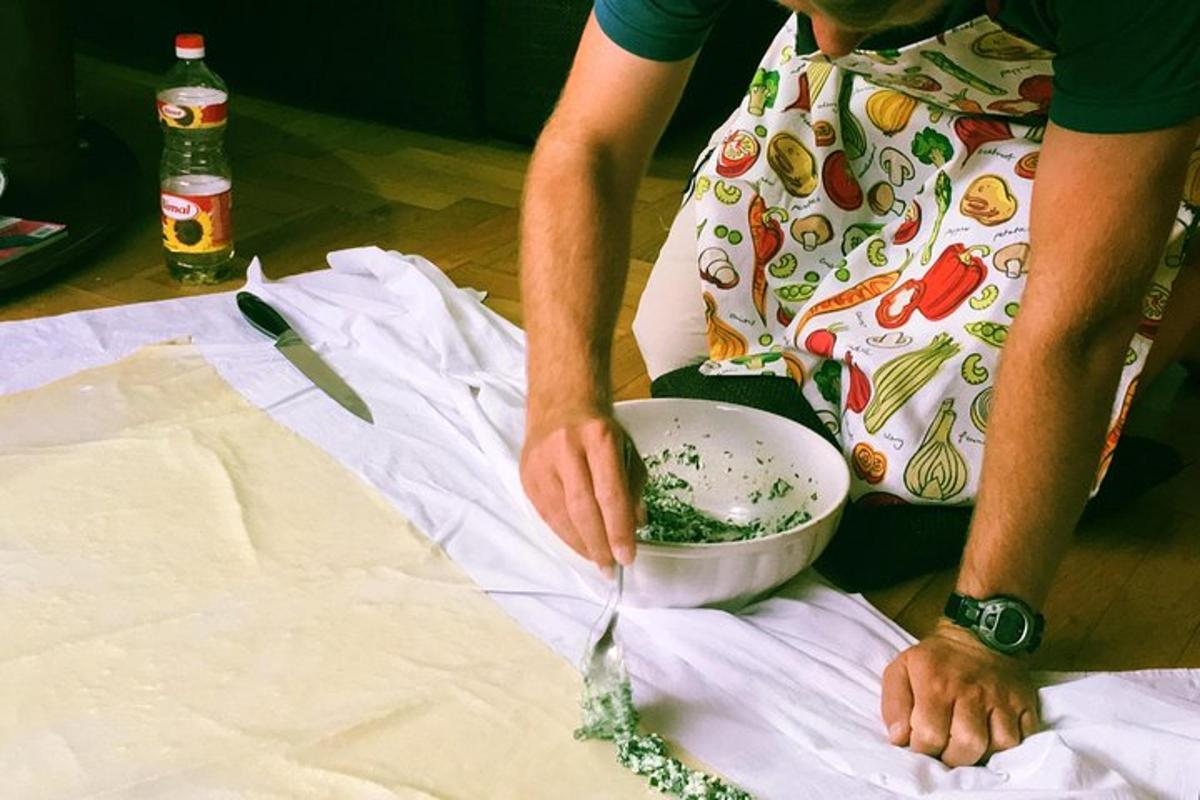 a woman in apron mixing ingredients in a bowl
