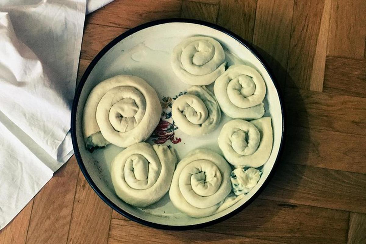 a plate of donuts on top of a wooden table
