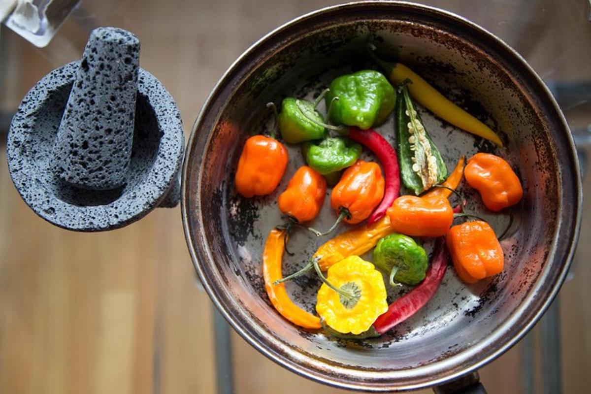 a pot filled with peppers and other vegetables