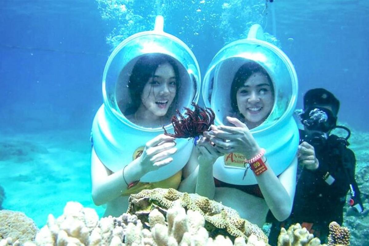 two young girls in an inflatable pool in the water