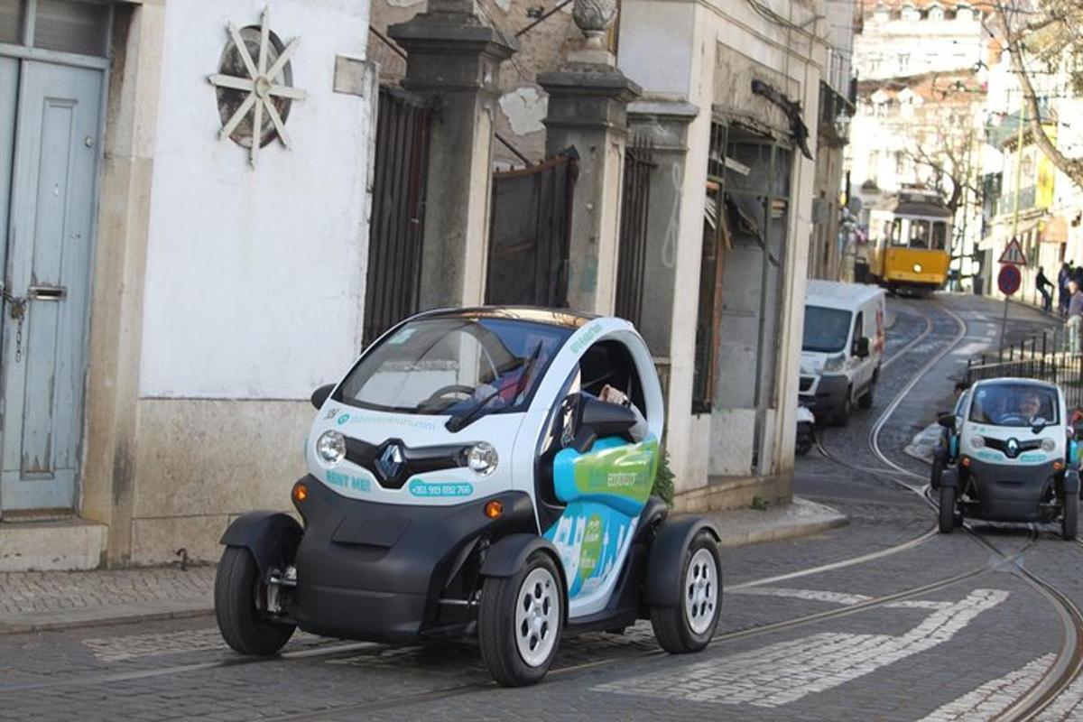 a small car driving down a city street