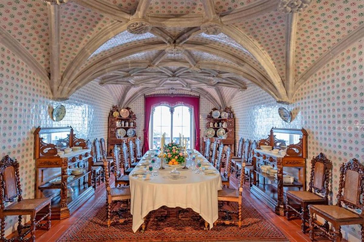 a large dining room with a table and chairs