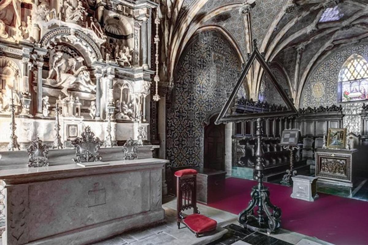 a church with a altar and a red chair