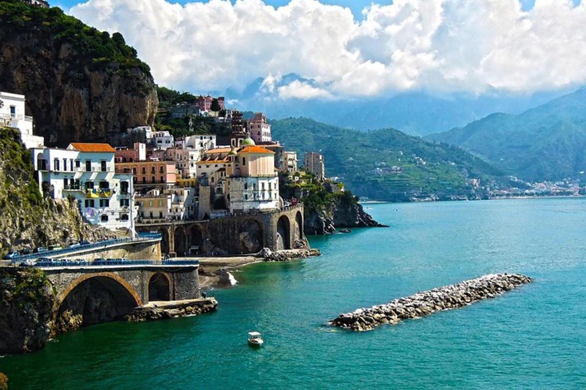 a group of buildings on the side of a river
