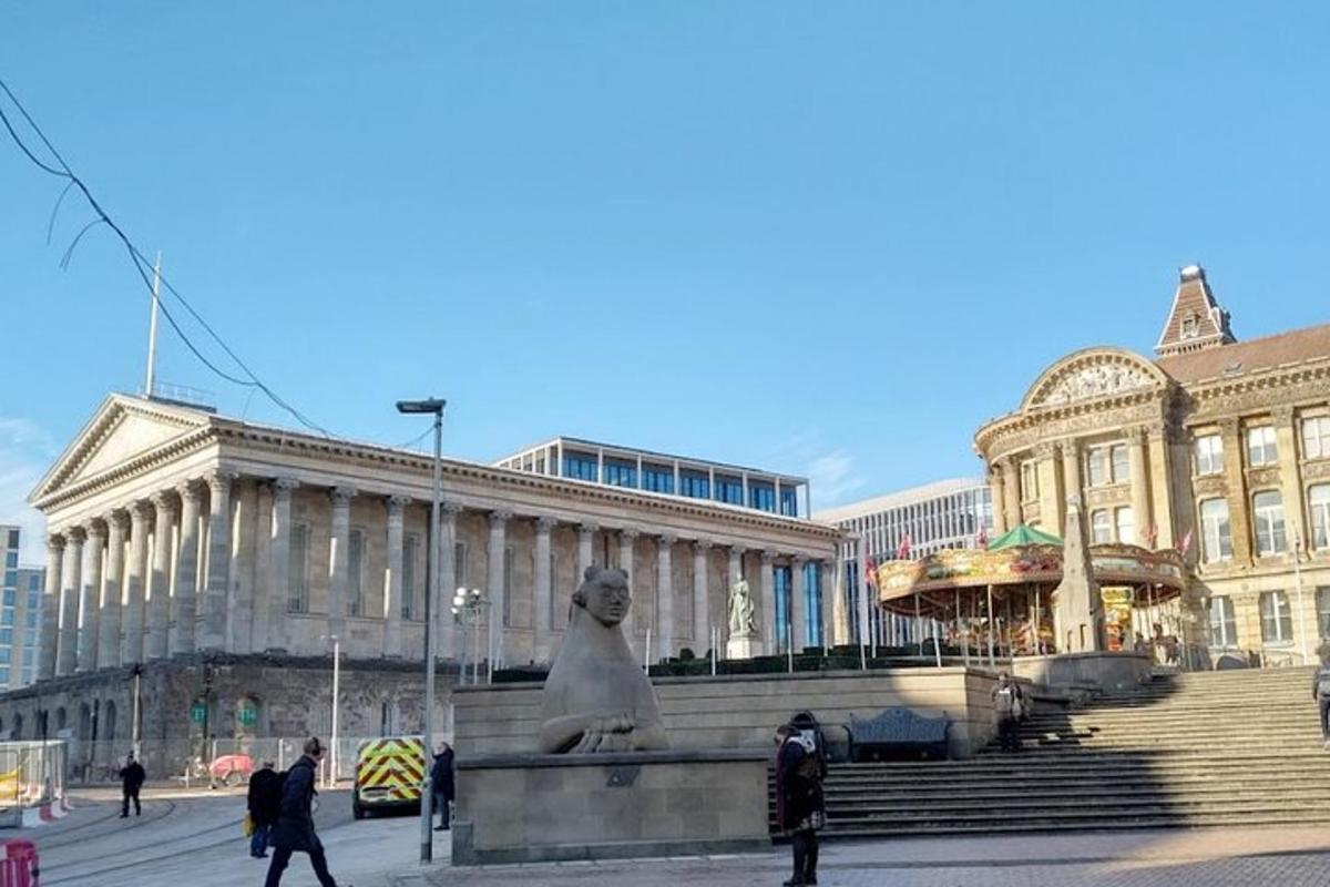 a large building with a statue in front of it