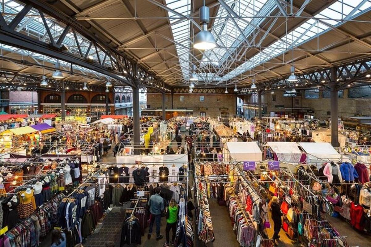 a large market with people walking around in a building