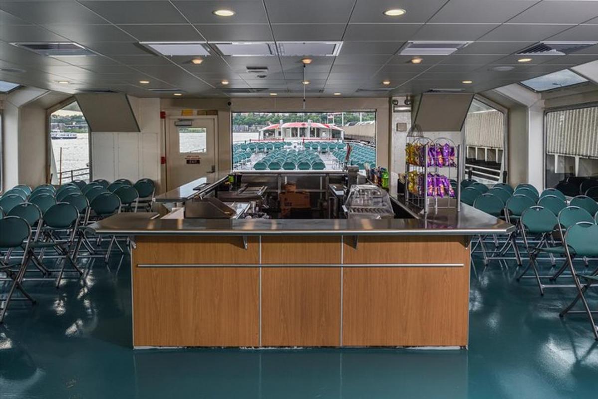 a room with a bar with chairs and a pool