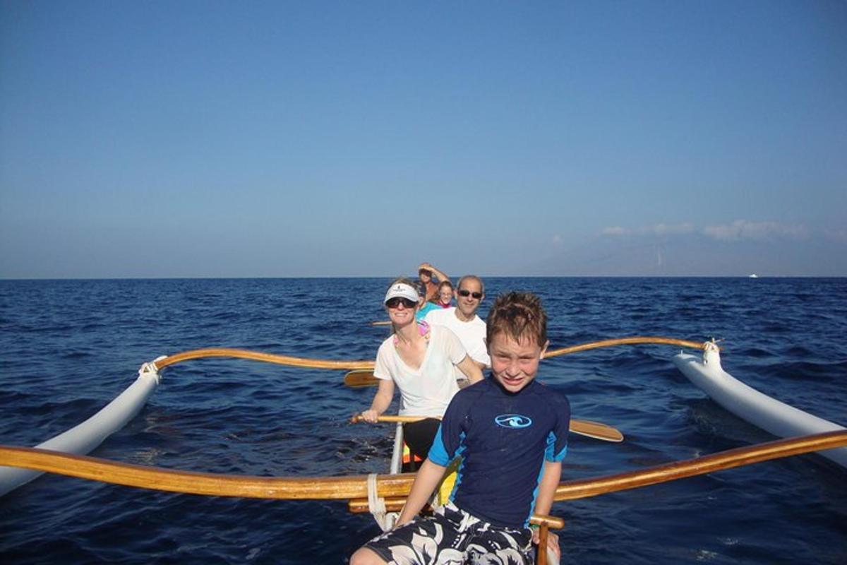 a group of people on a boat in the water