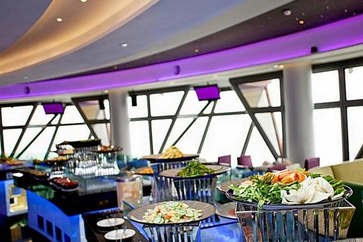 a dining room with tables with food on them