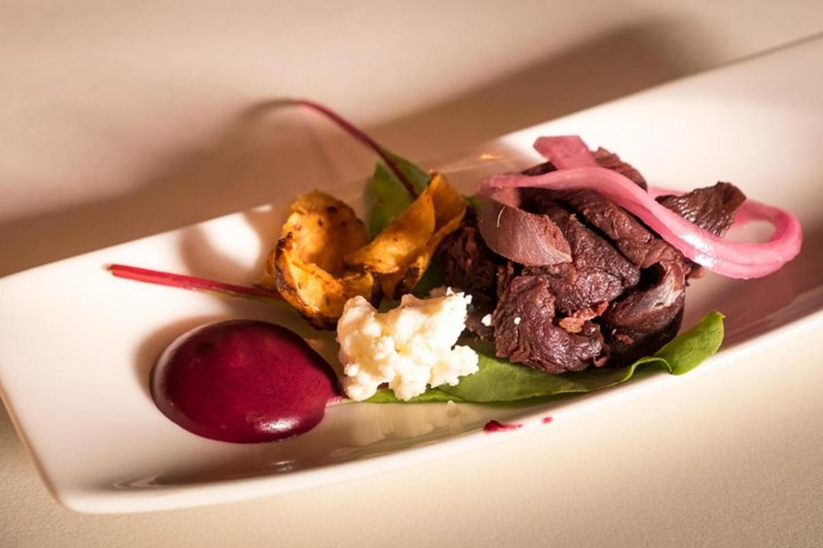 a plate of food with meat and vegetables on it