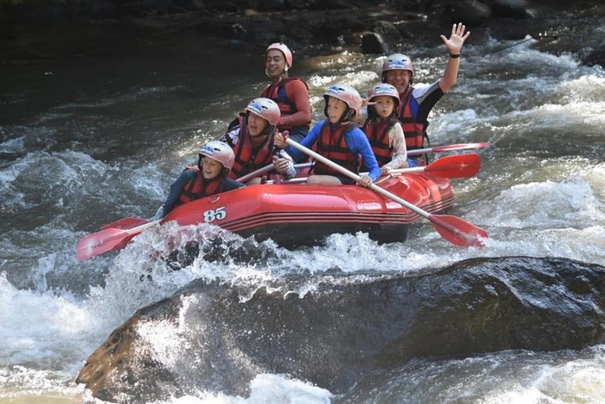 a group of people in a raft in a river