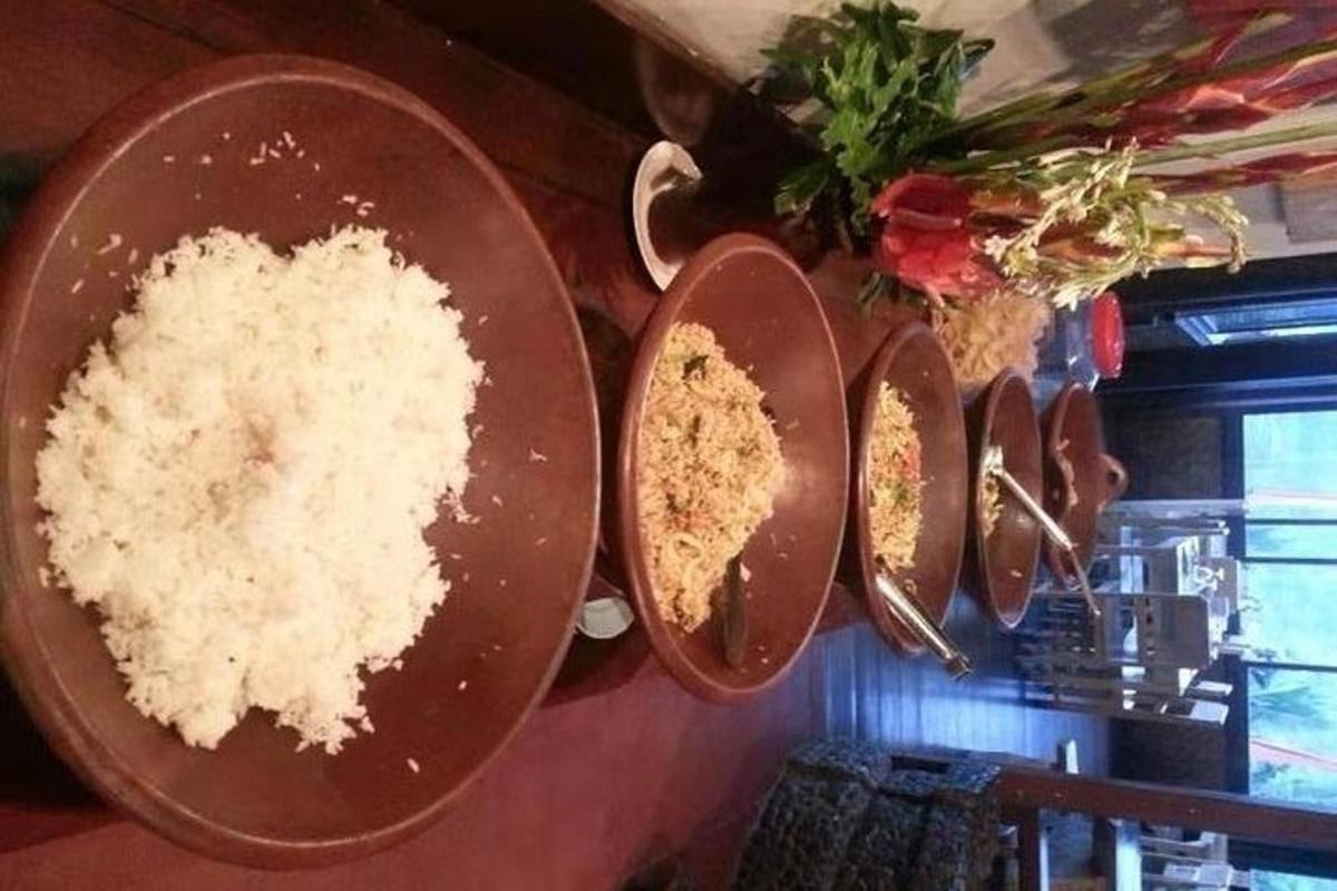 a bunch of plates with rice on a wall