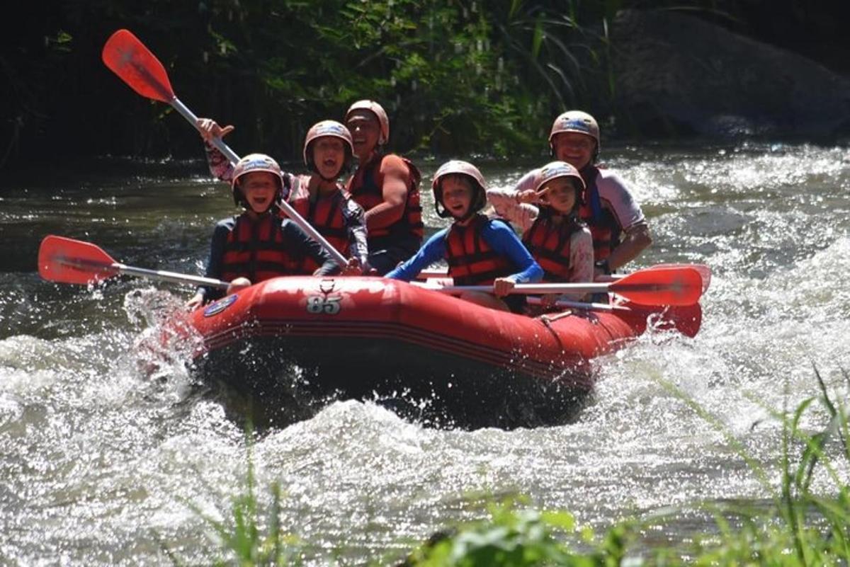 a group of people in a raft on a river