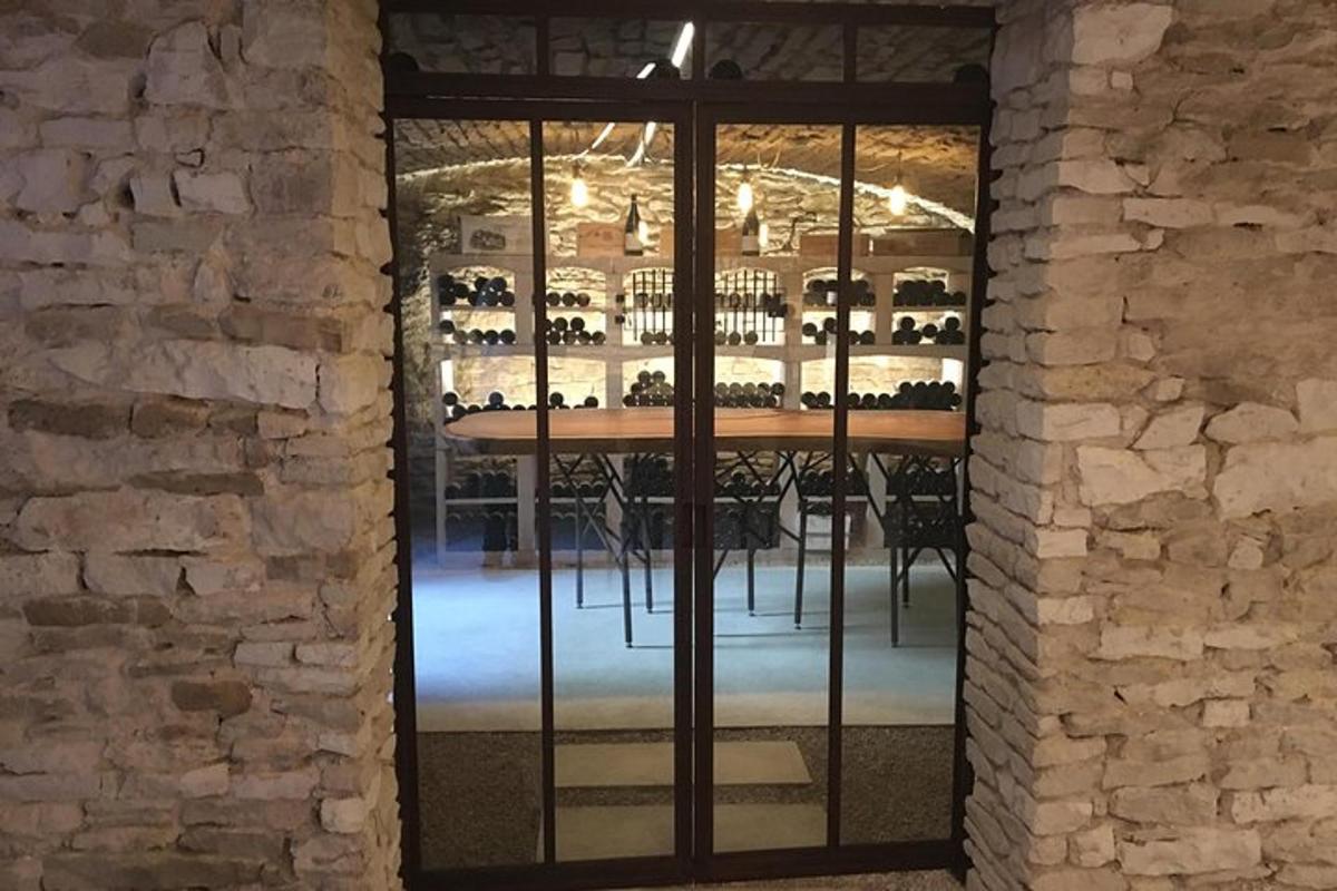 a bar in a wine cellar with a brick wall
