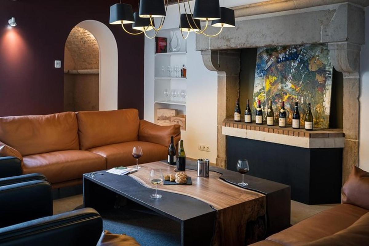 a living room with a couch and a table with wine bottles