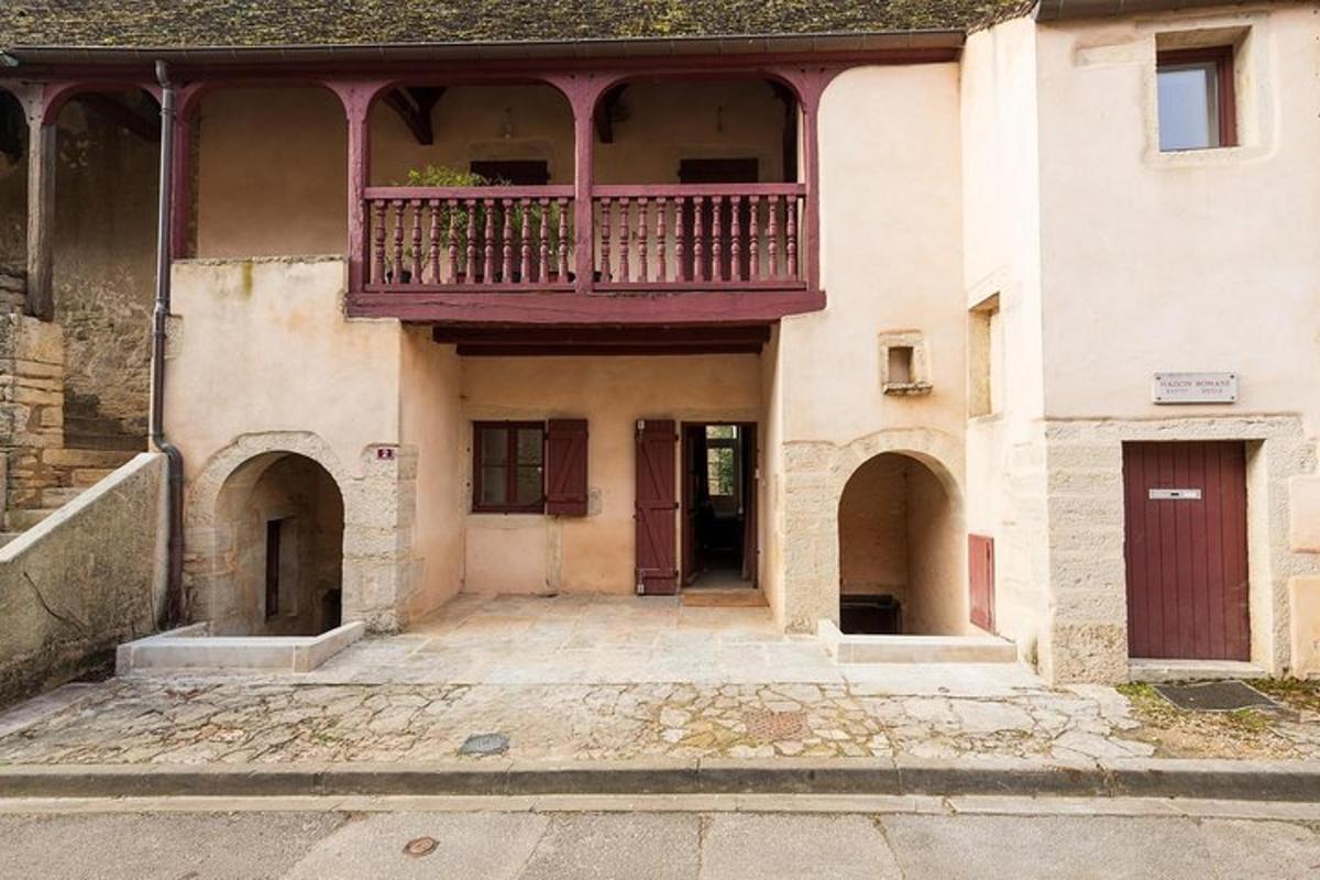 an old building with a balcony on top of it